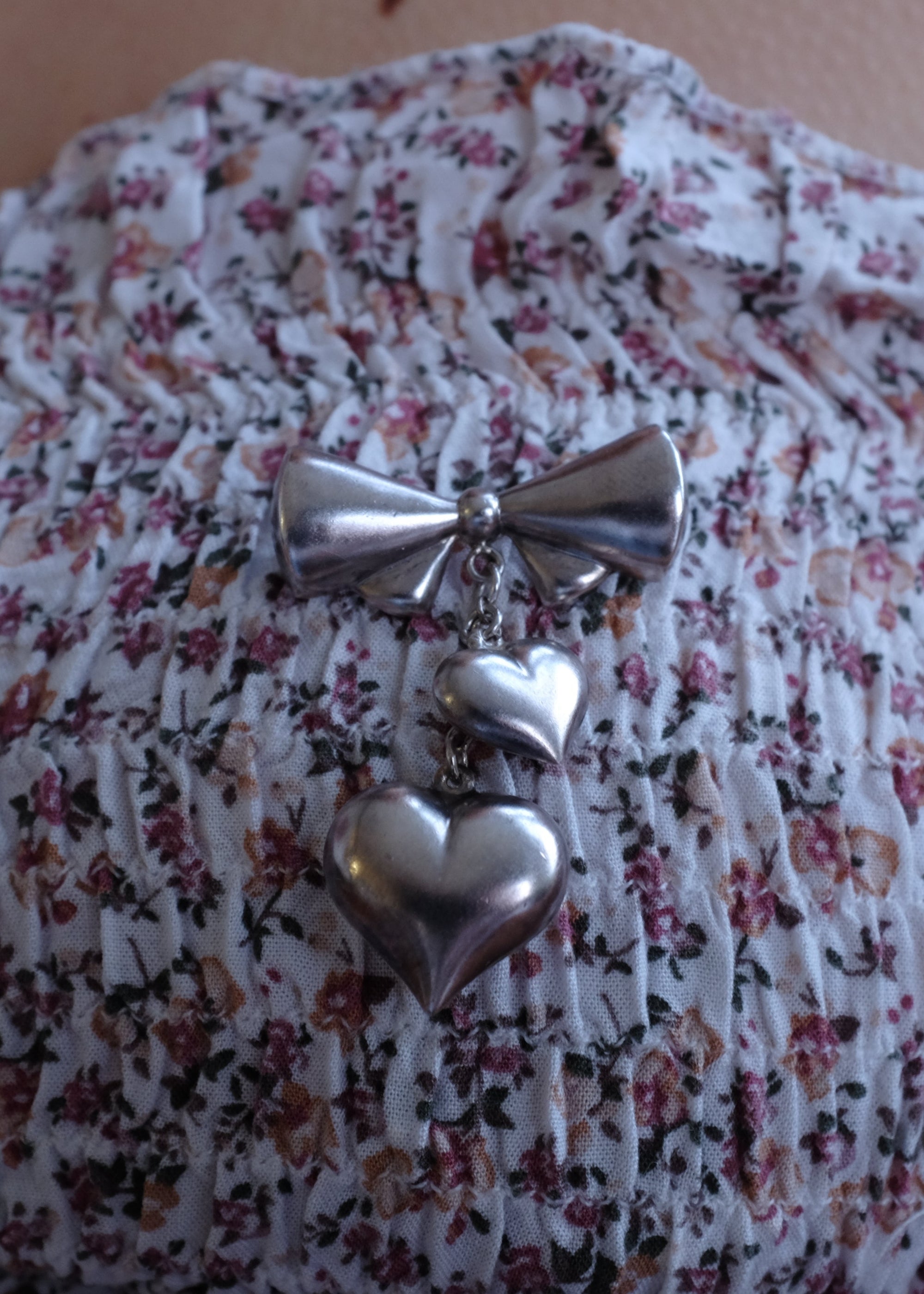 STERLING SILVER BOW HEART DROP BROOCH