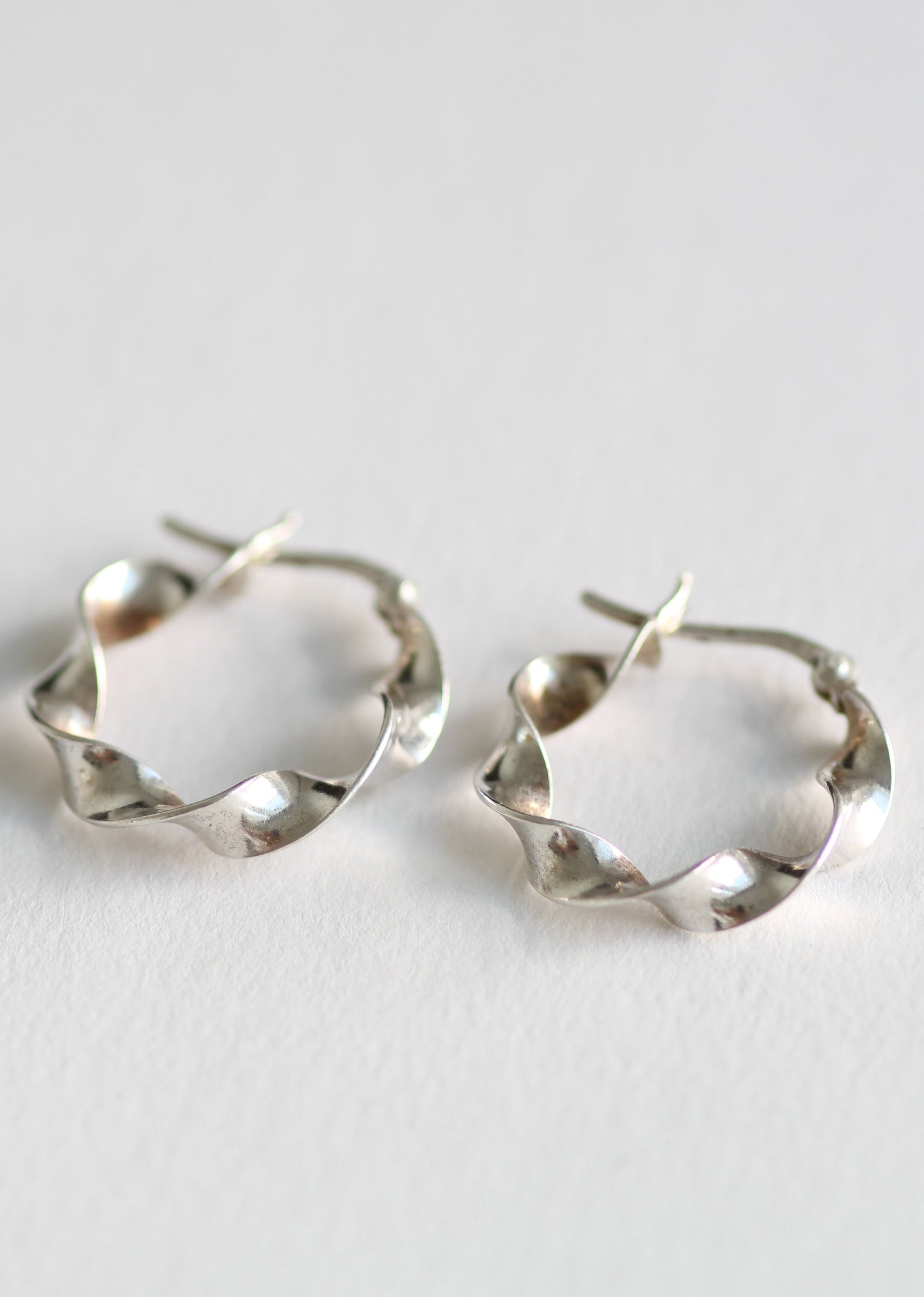 STERLING SILVER TWISTED HOOPS